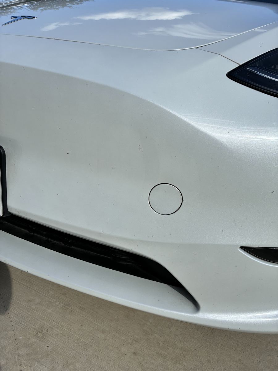 The same white bumper spotless after a Drip-N-Shine hand wash
