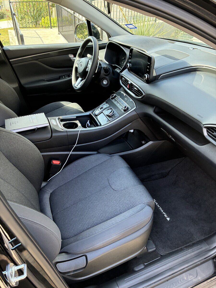 Clean SUV interior with vacuumed carpets and wiped dash after a Drip-N-Shine interior service